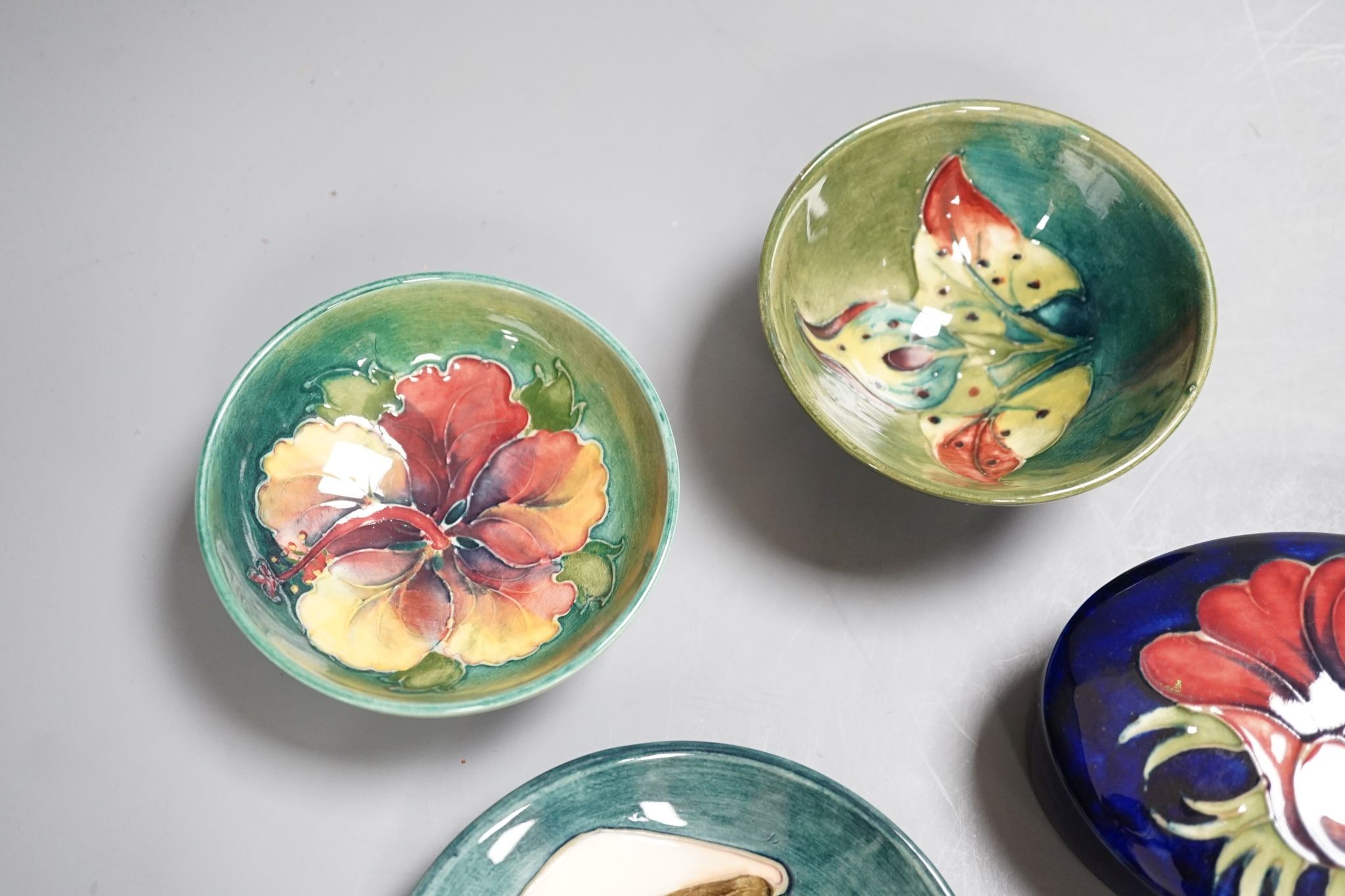 A Moorcroft vase, a similar box, 2 dishes and 2 bowls, Vase 29 cms high.